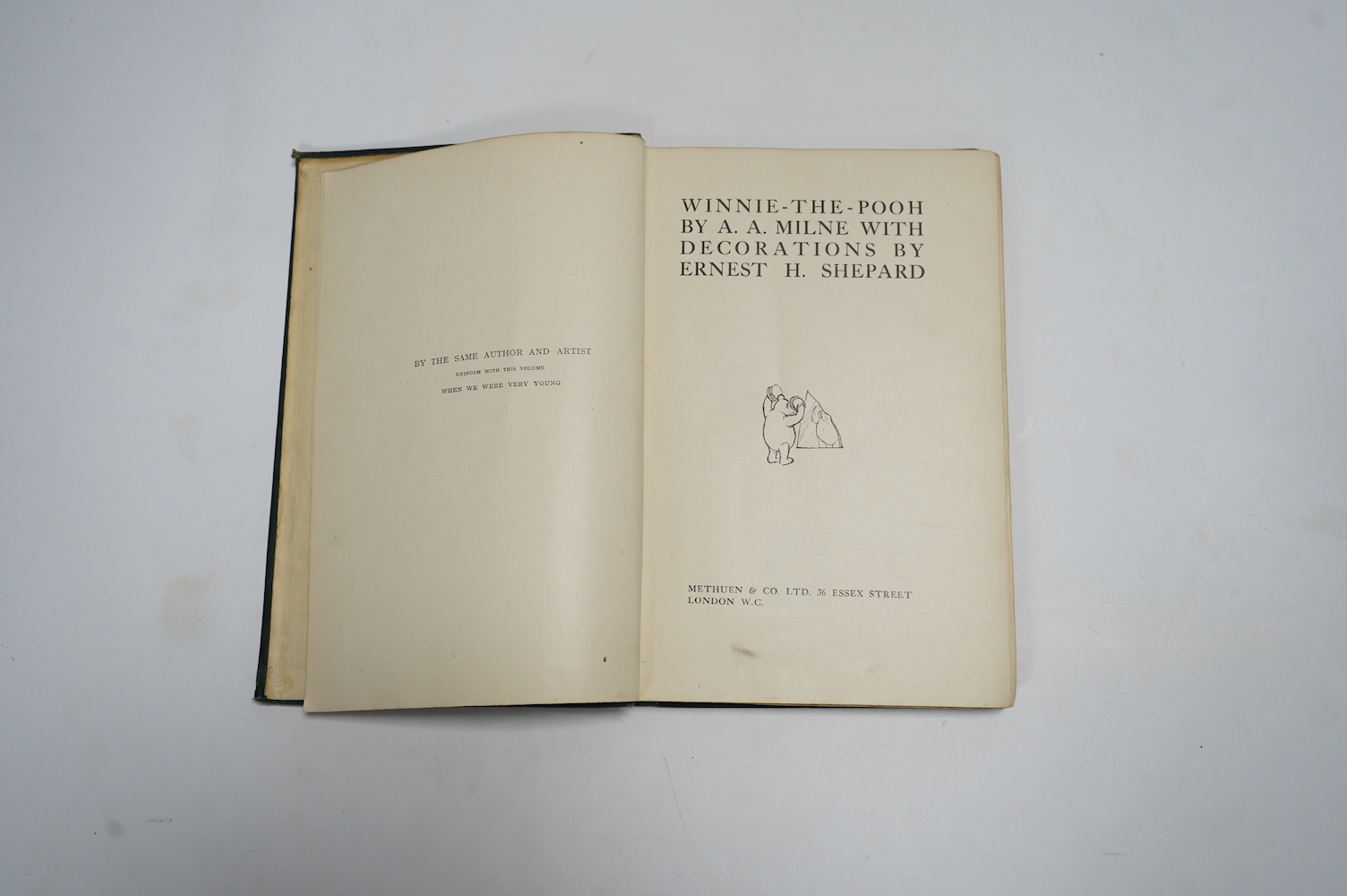 Milne, A.A. – Winnie-The-Pooh, first edition, 8vo, numerous illustrations (by Ernest H. Shepard), pictorial map on e/ps, half-title, original green cloth, pictorial gilt, t.e.g., Methuen & Co., 1926; A.A. Milne – The Hou